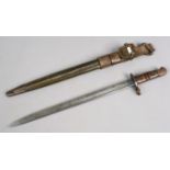 An American Remmington sword bayonet in leather scabbard.