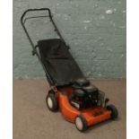 A Briggs Straton Orion petrol lawn mower.