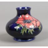 A Moorcroft gourd shaped vase decorated in the Magnolia design.