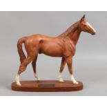 A Beswick connoisseur model The Minstrel racehorse of the year 1977, matt chestnut on wooden plinth.