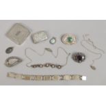 A collection of silver jewellery, match strike, brooches etc,