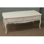 A Laura Ashley white painted coffee table with two drawers.
