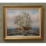 A gilt framed oil on canvas naval battle scene, signed P. Davis.