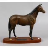 A Beswick connoisseur model Psalm racehorse, matt brown on wooden plinth.