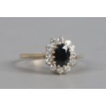 A 9ct gold sapphire and white paste coronet cluster ring, size P.