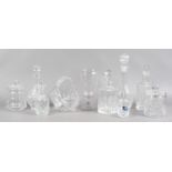 A group of glasswares including a celery vase, Stuart crystal, cut glass decanters,