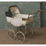 A childs vintage Triang pram.