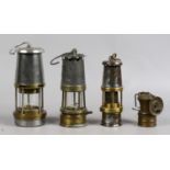 Four vintage miners lamps to include wolf, baby wolf,