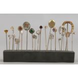 A collection of 22 Victorian stickpins mostly yellow metal examples set with coloured stones.