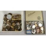 A box of antique watch movements.