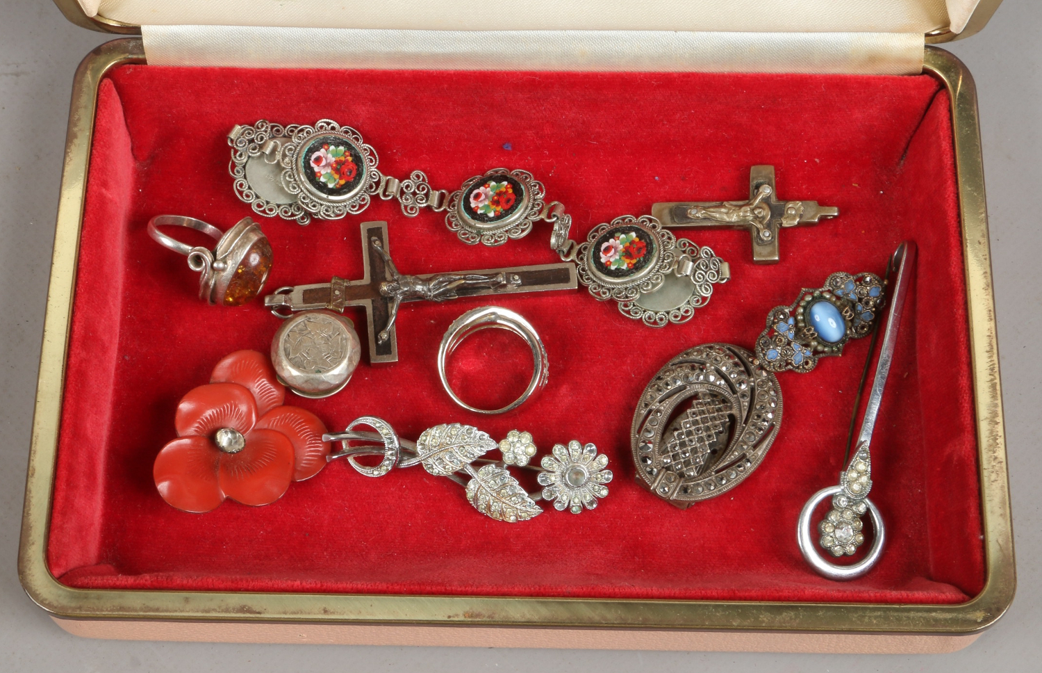 A quantity of costume jewellery including brooches, rings etc.
