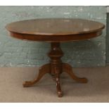 A centre pedestal oval extending table and set of six matching cabriole leg chairs.