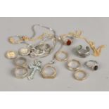 A small selection of costume jewellery to include silver gem set rings, crucifix etc.