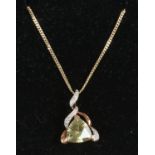 A 9ct gold pendant and chain set with diamonds and lemon quartz.