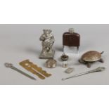 A box of collectables including hip flask, letter opener, vintage metal tortoise toy etc.