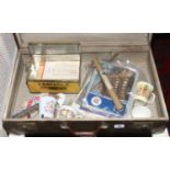A vintage metal bound suitcase and contents of commemorative books, beakers,