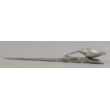 A letter opener with white metal handle formed as a pheasant on branch.