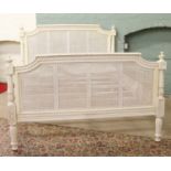 A white painted double bed frame with double skin bergere headboard and kickboard.