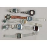 A box of assorted vintage digital wristwatches.