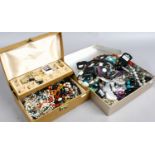 Two jewellery boxes and contents of costume jewellery beads, chains, bangles etc.