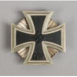 A World War II German Third Reich iron cross merit badge, 1st class with screw back.