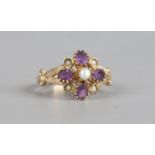 A 9ct gold ring, floriform set with amethyst and pearls, size K.