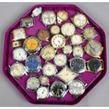 A tray of wristwatch heads.