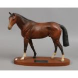 A Beswick connoisseur model Troy racehorse of the year 1979 matt brown on wooden plinth.