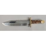 A Bowie Knife with antler scales and brass cross guard by Mortons of Sheffield with work buck