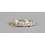 A 9ct gold ring set with five white paste stones, size P.