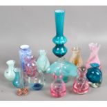 A group of collectable coloured glass including Caithness examples.