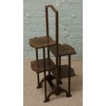 An oak stepped four tier folding cakestand.