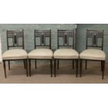 A set of four carved mahogany salon chairs.