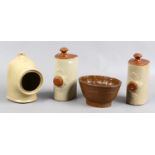 A collection of stoneware items to include treacle glaze jelly mould, bed warmers and salt pig.