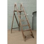 A pair of wooden step ladders.