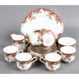 A Royal Stafford bone china part tea service in the 'Olde English Garden' pattern including cups