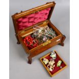 A carved oak jewellery box and assorted costume jewellery including white paste and simulated