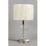 A graduated crystal and chrome tablelamp with shade.