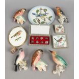 A group of vintage pottery wall mounting models of birds, along with two Goebel plaques,