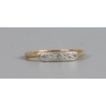 An 18ct gold and platinum five stone diamond ring, size M1/2.