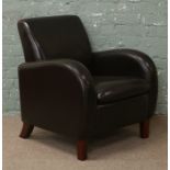 A brown leatherette arm chair.