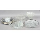 A collection of cut and etched glass, cake stands, candlesticks,