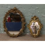 Two gilt framed plaster cast wall mirrors.