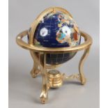 A 360 rotating hardstone globe on stand with in built compass.