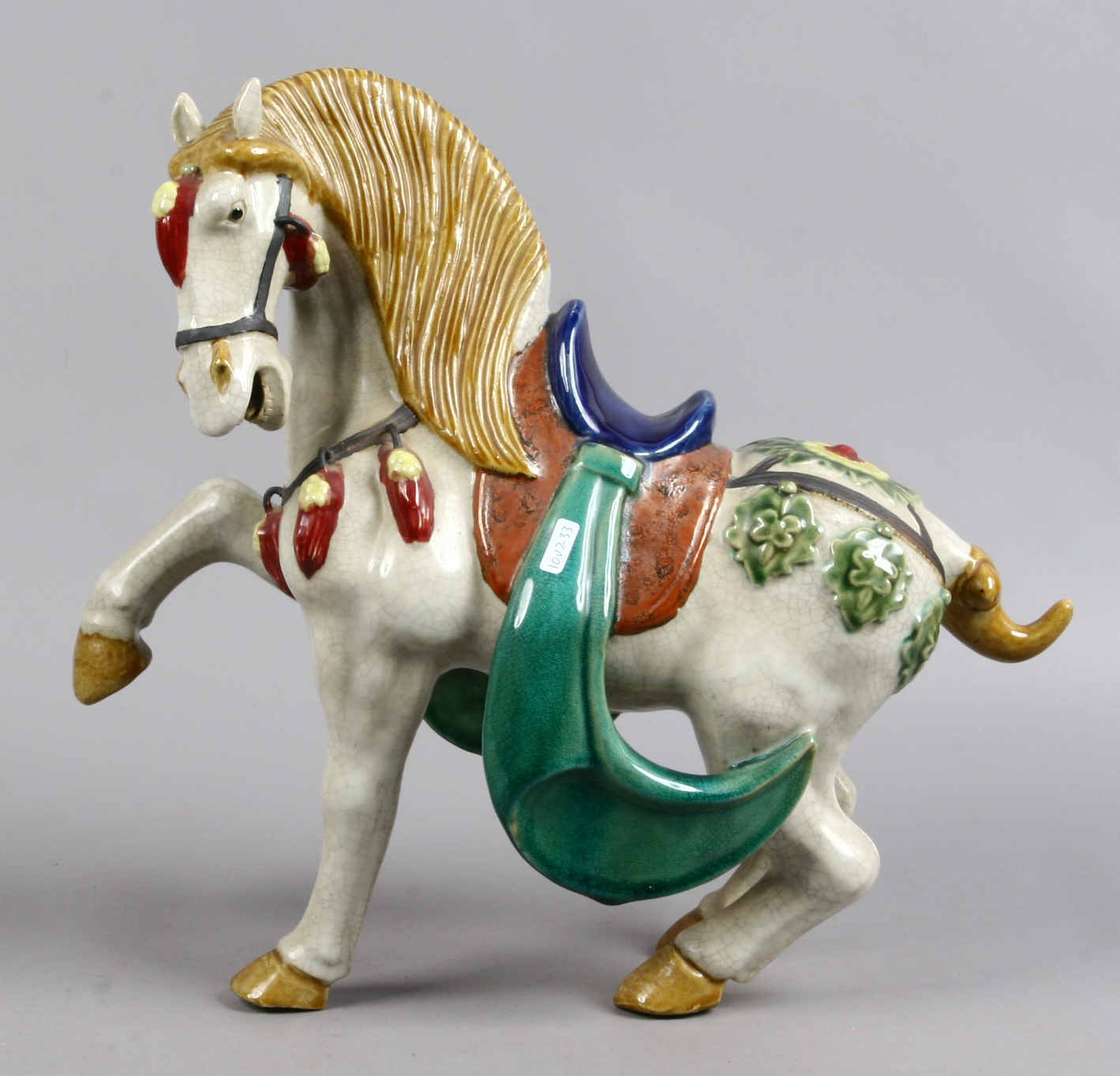 A large pottery figure of a horse, after a Tang Dynasty original.