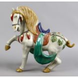 A large pottery figure of a horse, after a Tang Dynasty original.