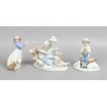 Three Nao figures, boy and a dog, girl with a cake and a shepherd boy.