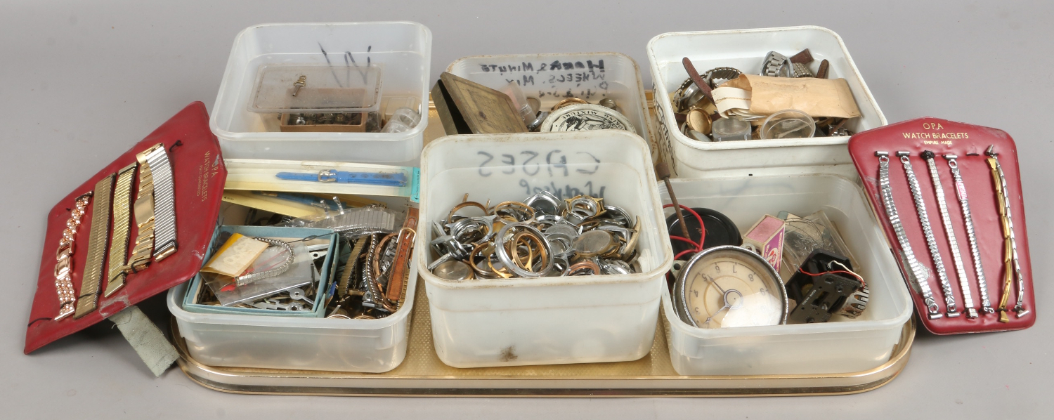 A tray of watch/clock spares and repairs.