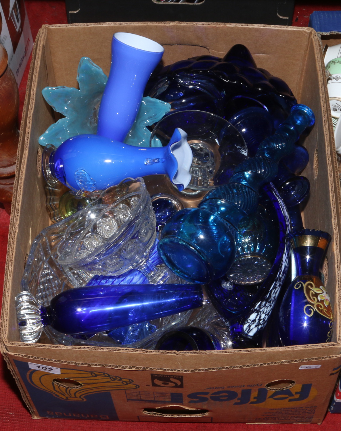 A box of mixed glasswares to include art glass, clear and coloured glass, ornamental examples etc.