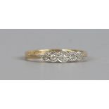 An 18ct gold and platinum five stone diamond ring, size N.